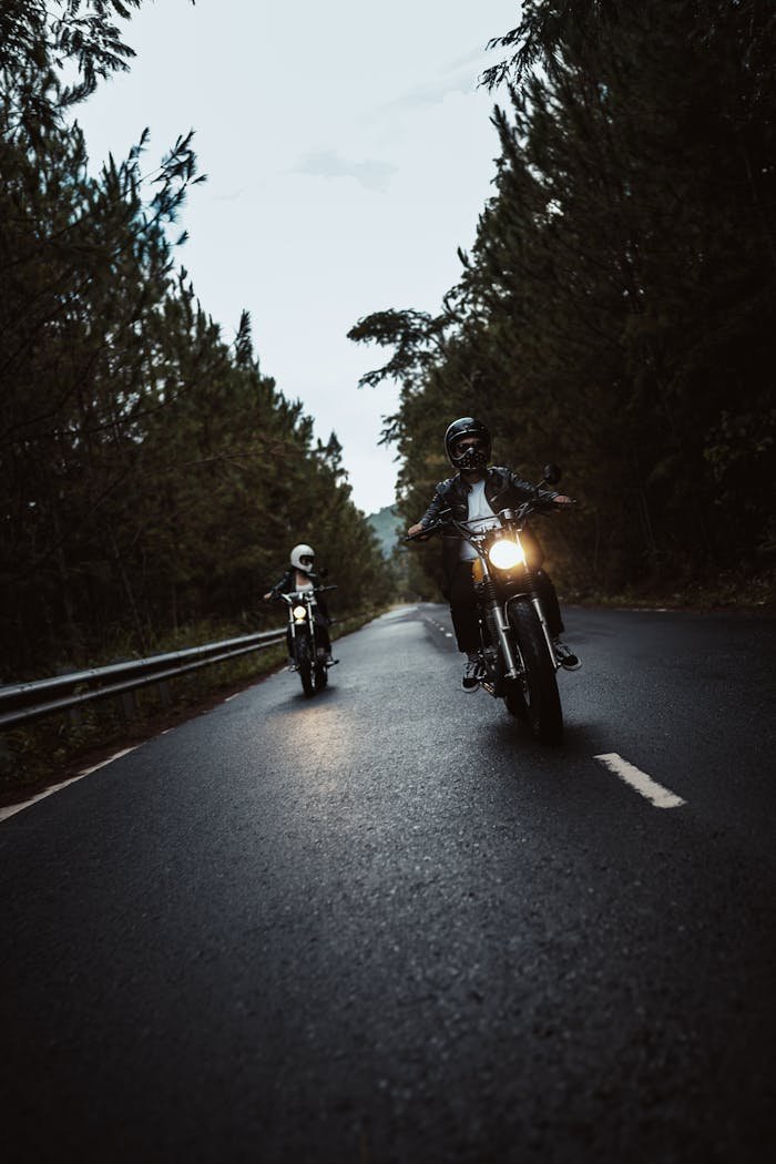 Men on Motorbikes in Among Trees